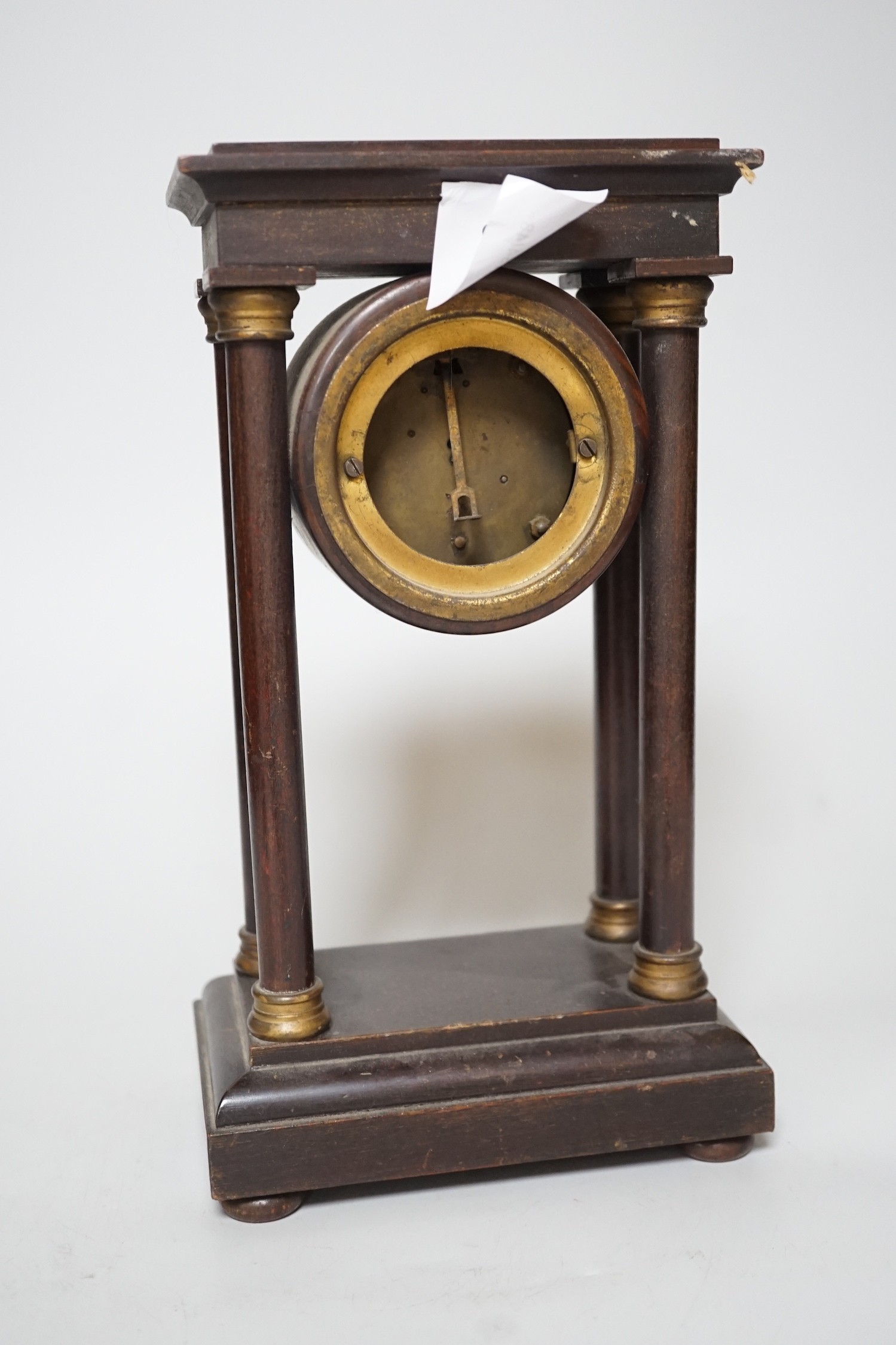 An Edwardian Portico-type mantel clock, 27cms high